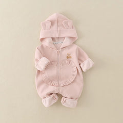 Blush pink baby romper with folded cuffs